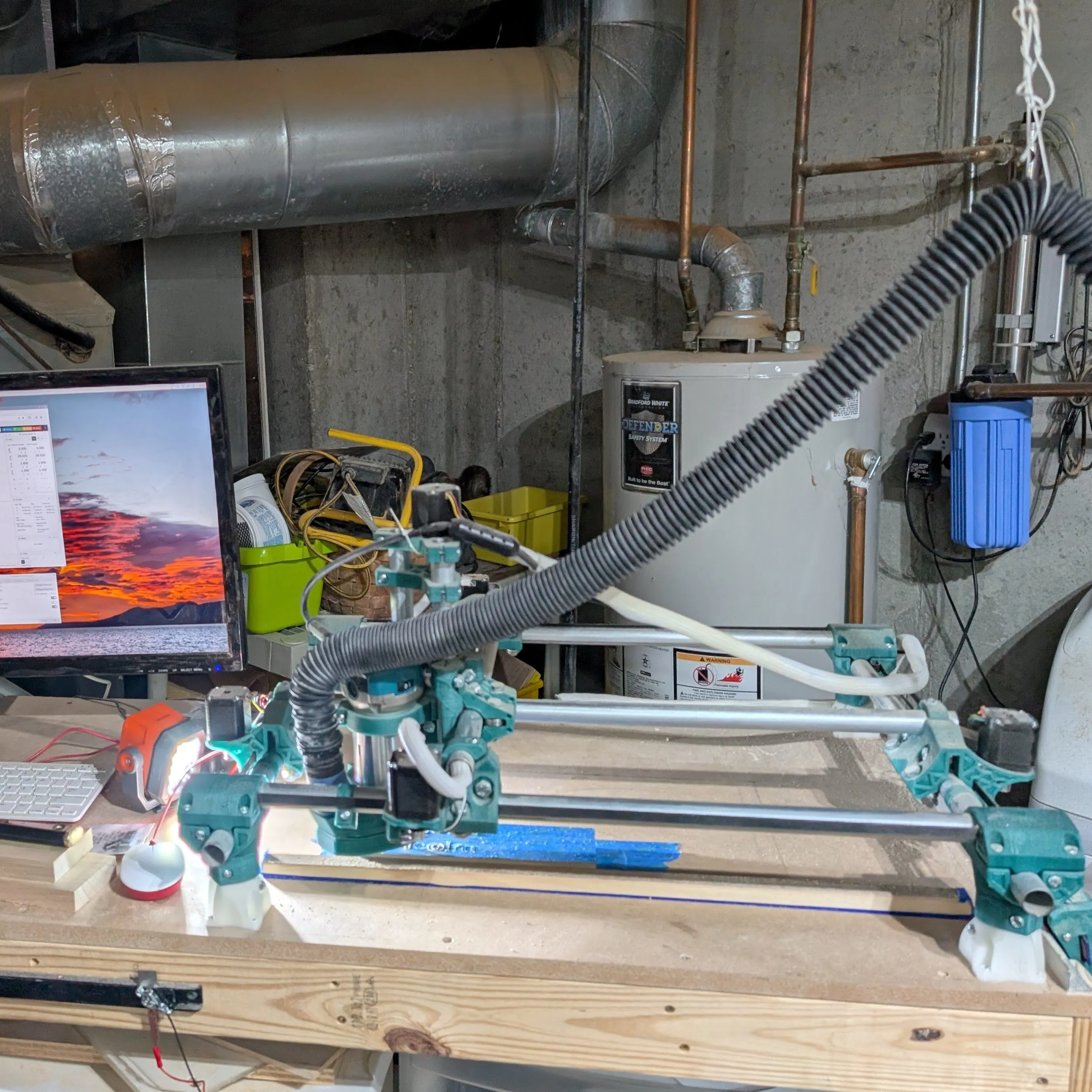 My DIY CNC in a cluttered corner of my unfinished basement